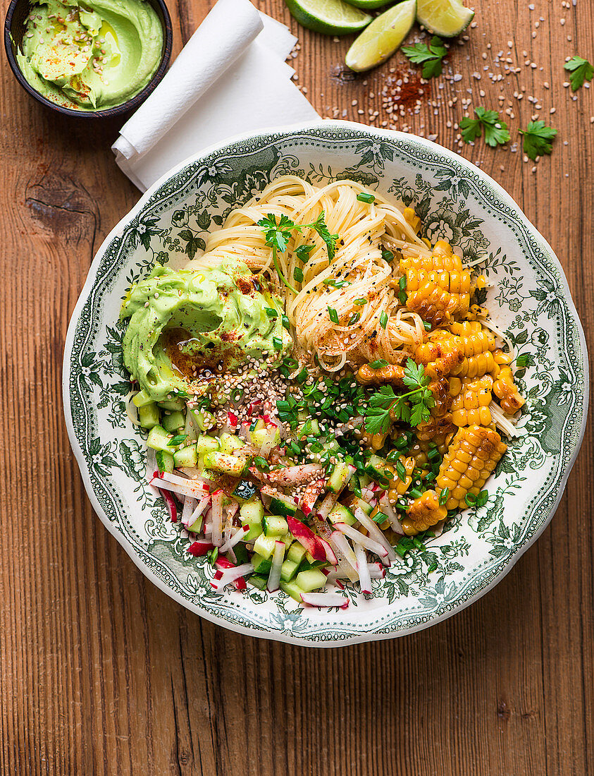Vegan spaghetti bowl with avocado and sesame seed mousse and salad