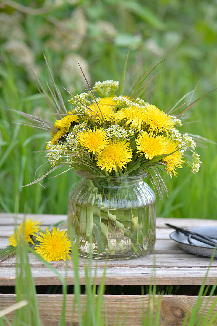 Bouquet of dandelions, cress and grass