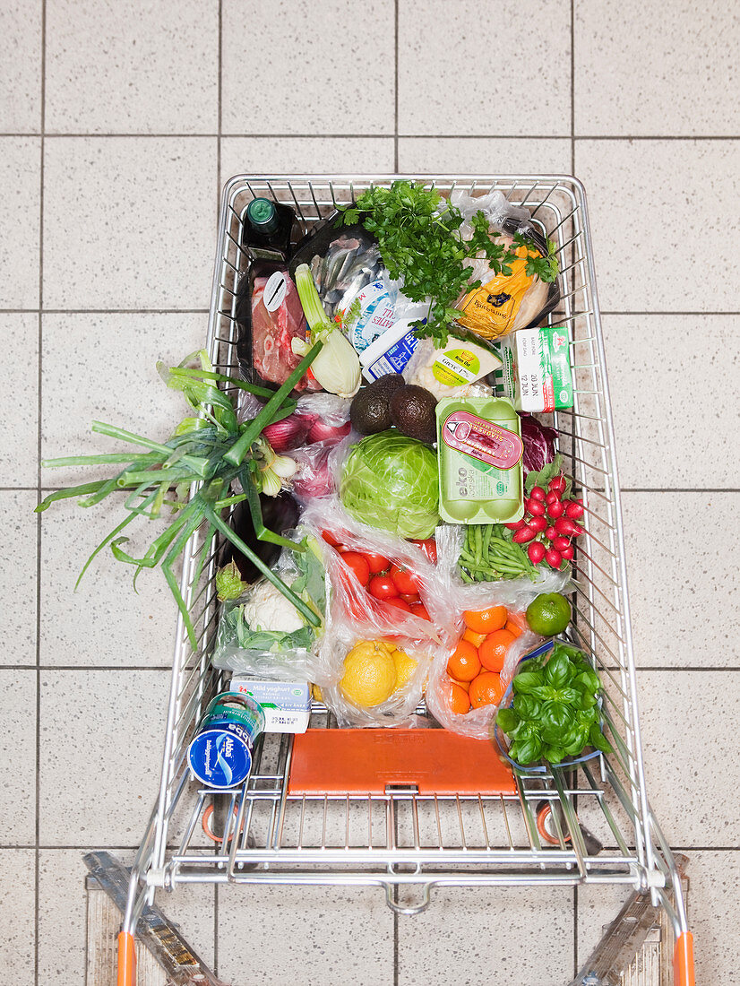 Overhead view of shopping cart with food