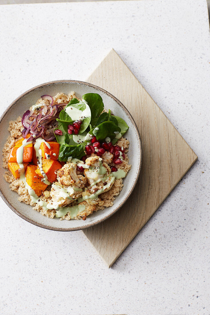 Pumpkin and couscous bowl with avocado and yoghurt