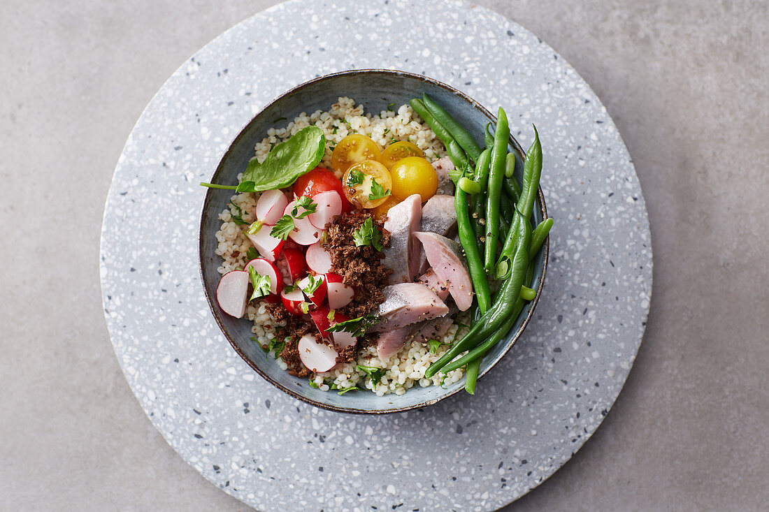 Barley and soused herring bowl with radishes