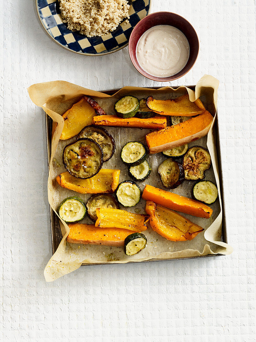 Oven-roasted vegetables with a tahini dip and quinoa