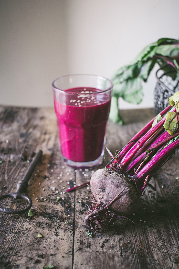 Beetroot and fresh smoothie on wooden table
