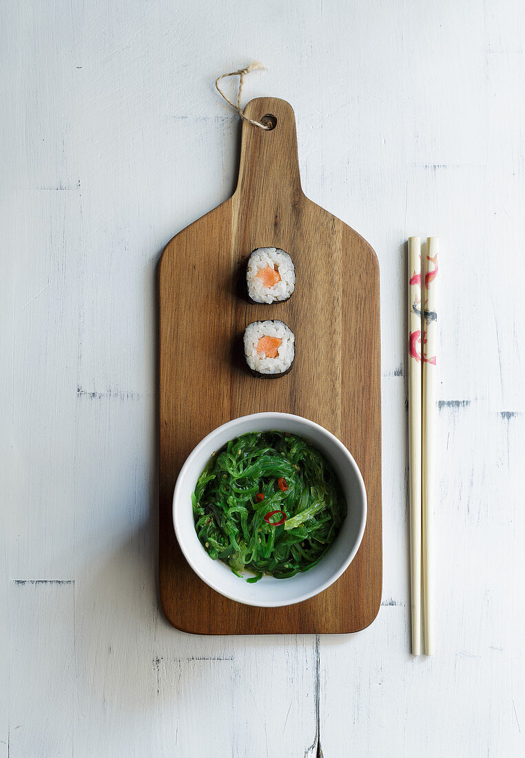 Maki sushi with seaweed salad