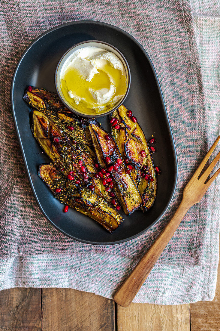 Grilled aubergine with labneh and pomegranate