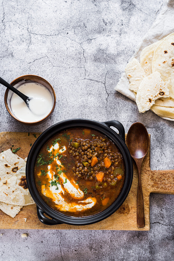 Spicy lentils soup with yoghurt