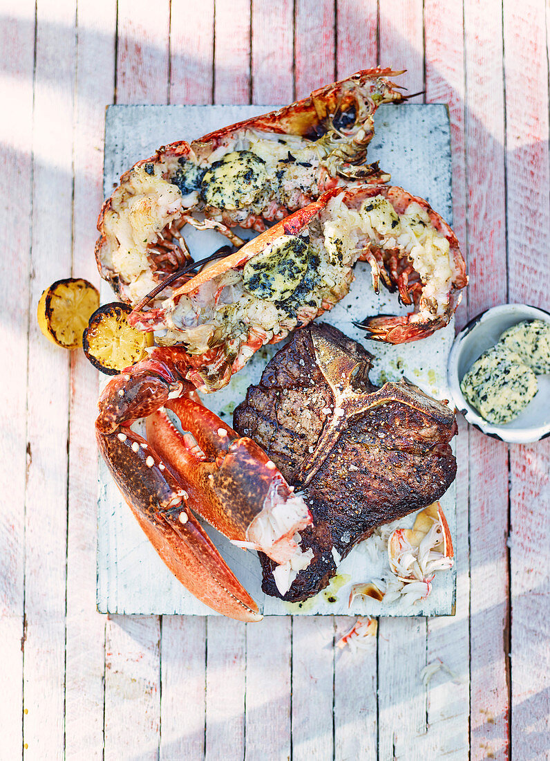 Surf and Turf (T-bone steak and lobster) grilled with seaweed butter