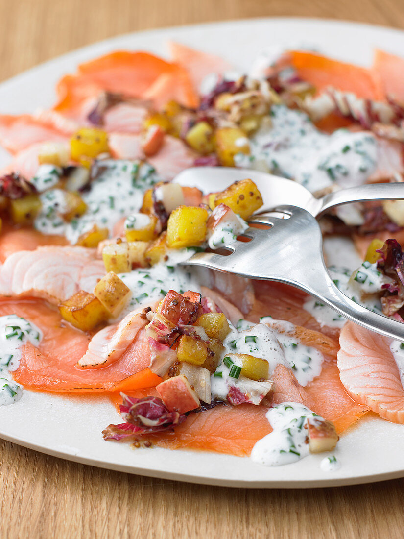 Salmon carpaccio with potatoes and pears