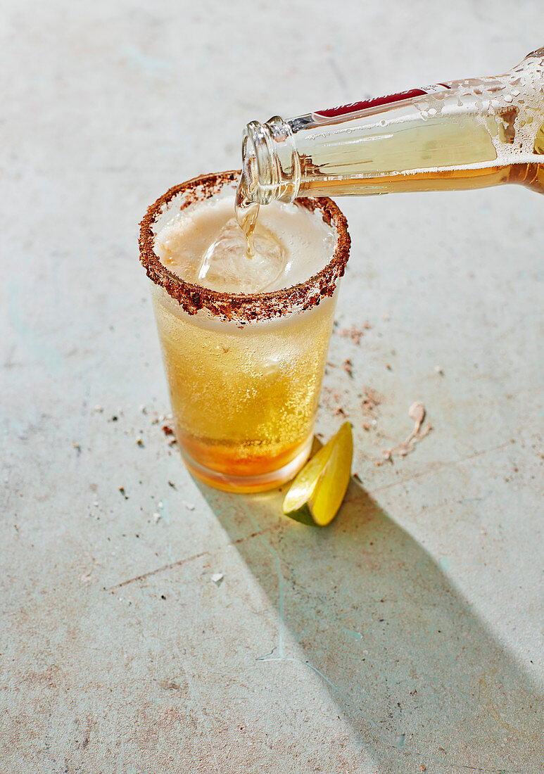 Michelada - Mexican beer cocktail with chilli and hot sauce