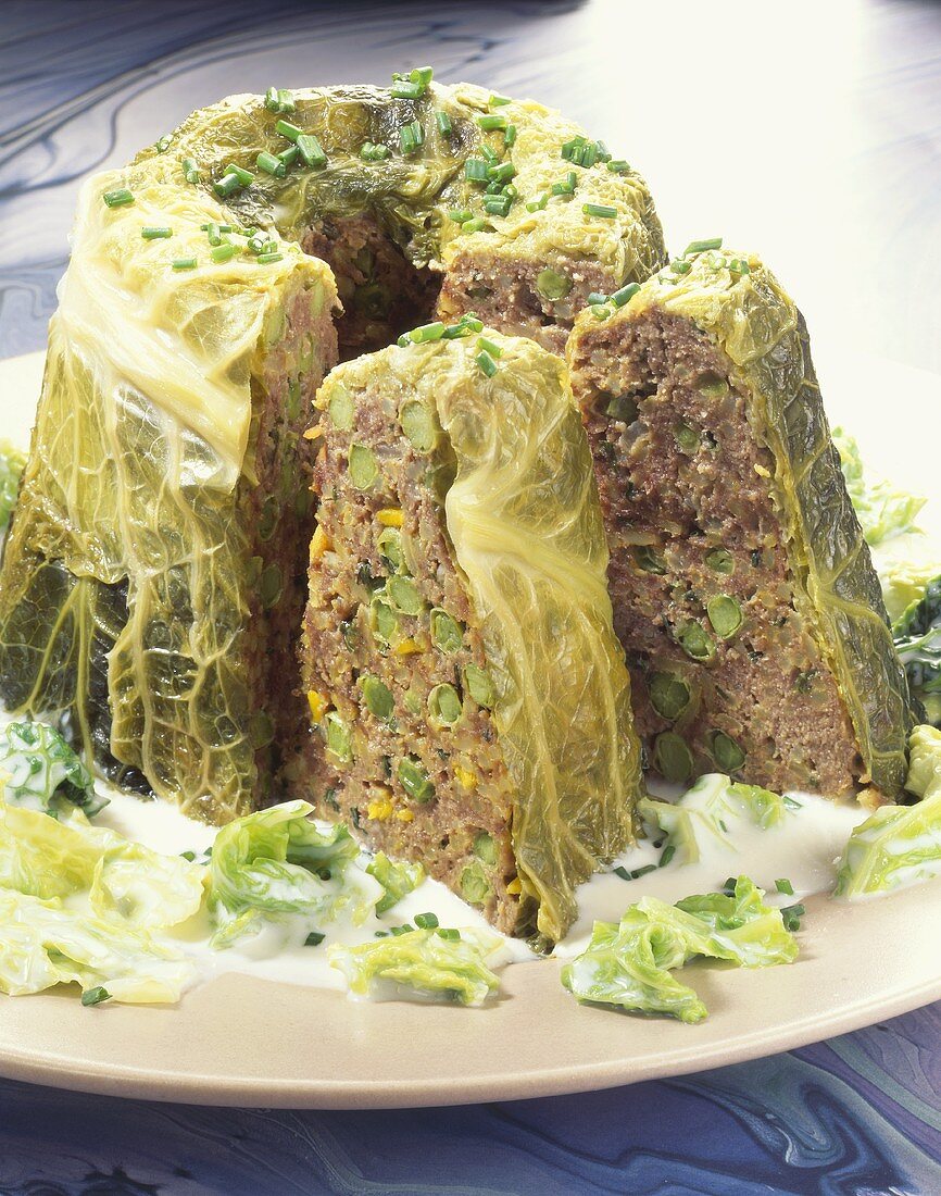 Meatloaf in savoy leaves with cream sauce