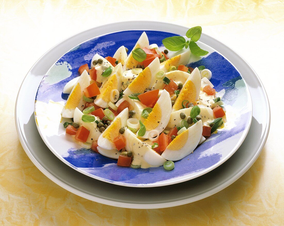 Egg salad with tomatoes, spring onions and capers
