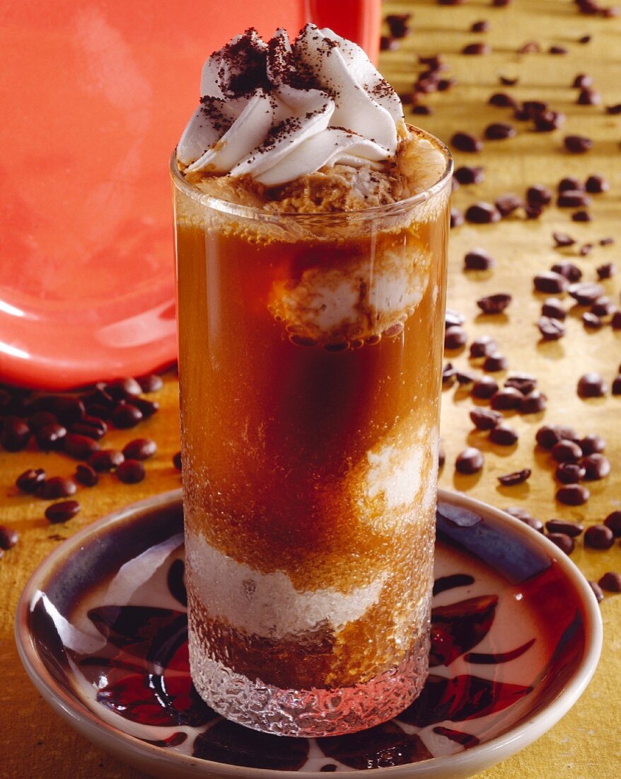 A glass of iced coffee, decoration: coffee bean