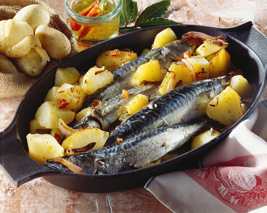 Mackerel with potatoes in a dish