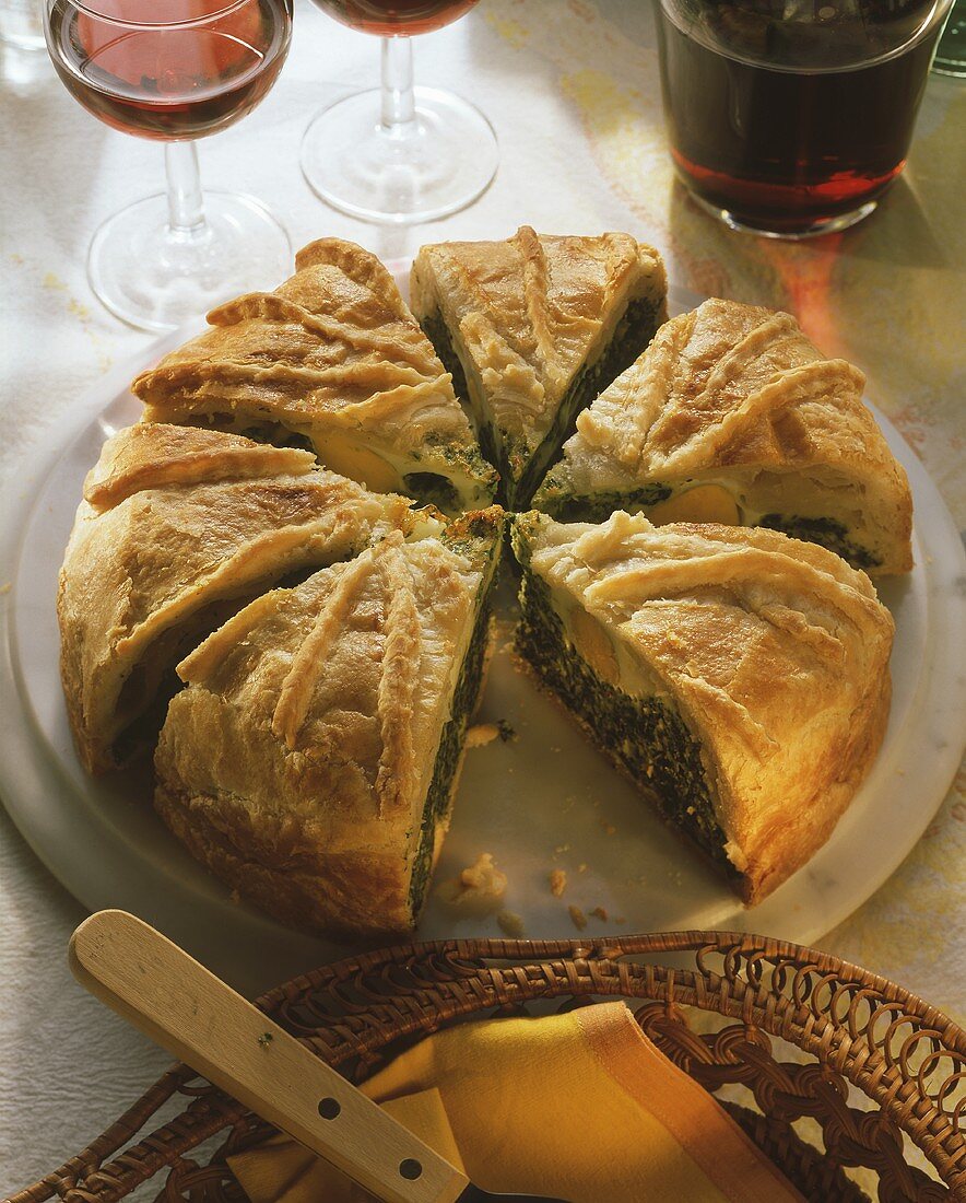 Puff pastry pie with spinach & ricotta filling and egg