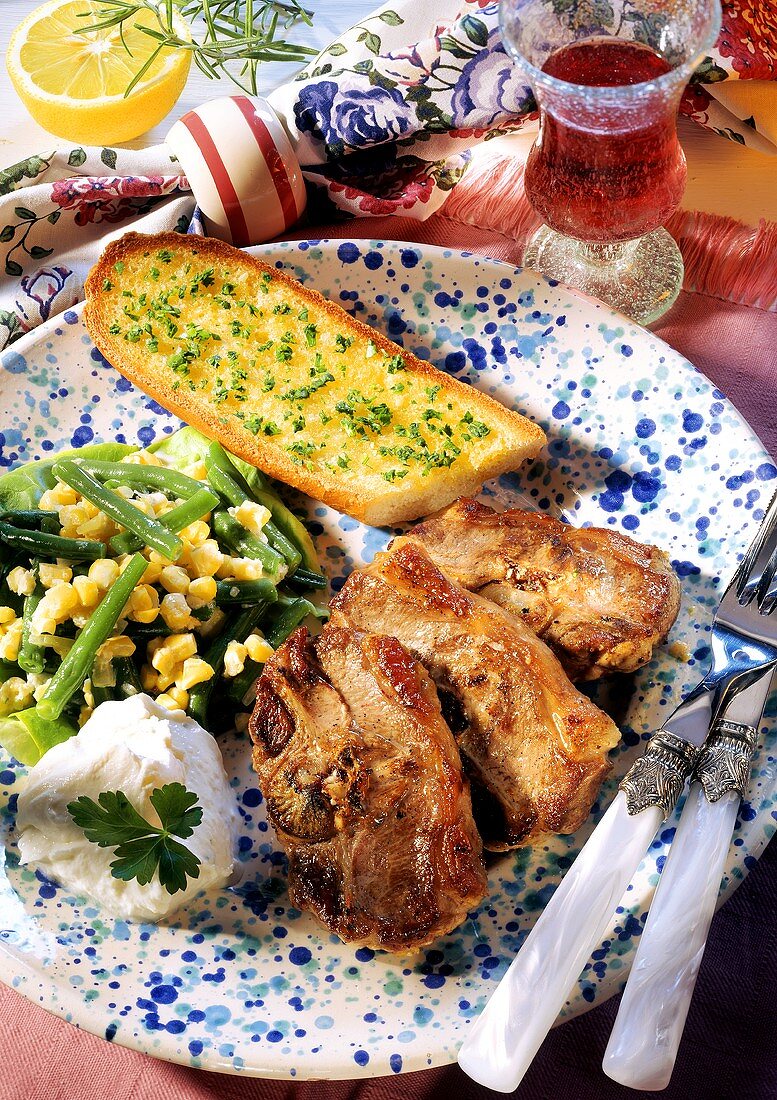 Lamb cutlets with beans & sweetcorn & garlic baguette