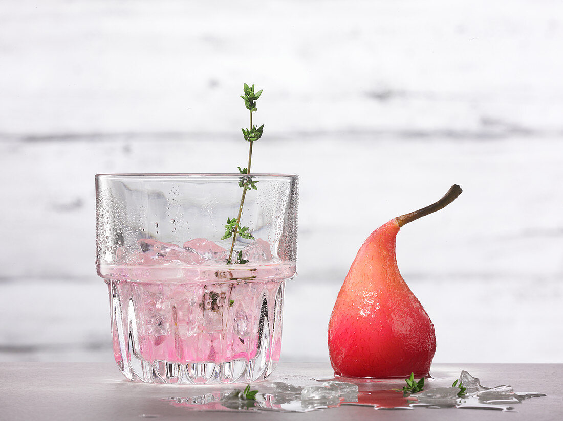 Strawberry gin with thyme and a poached pear