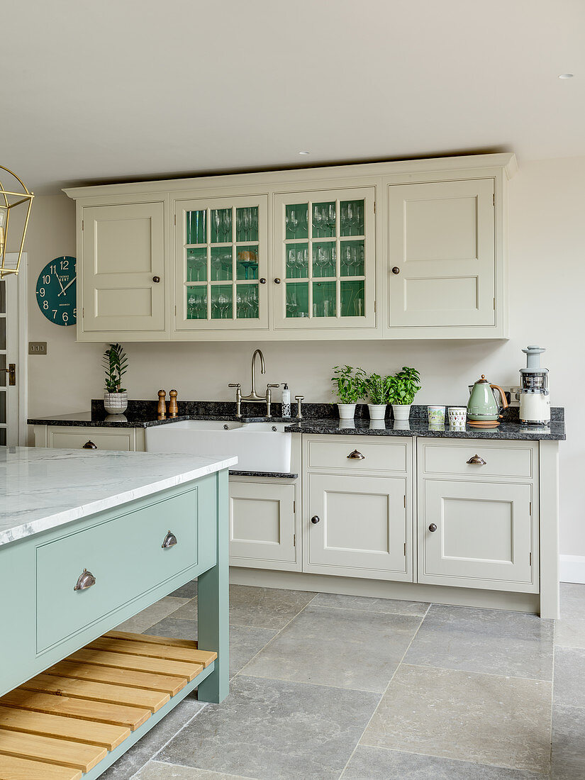 Cream country-house kitchen with pale blue island counter
