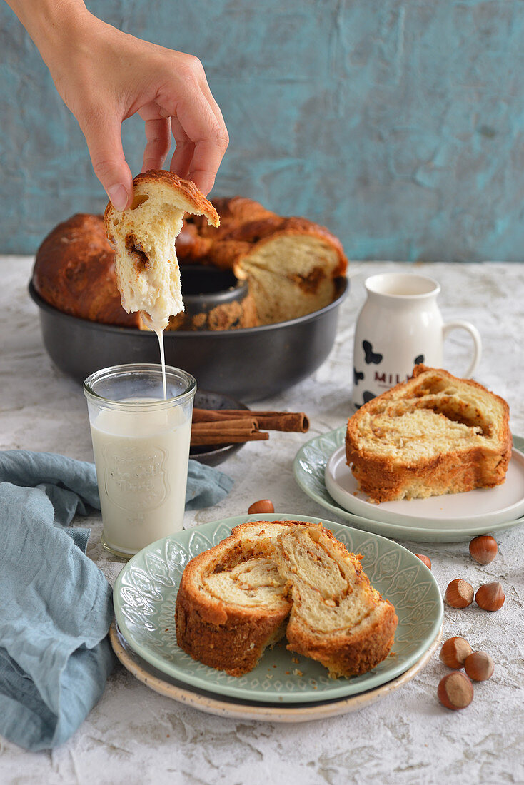 Roll cake with cinnamon a glass of milk