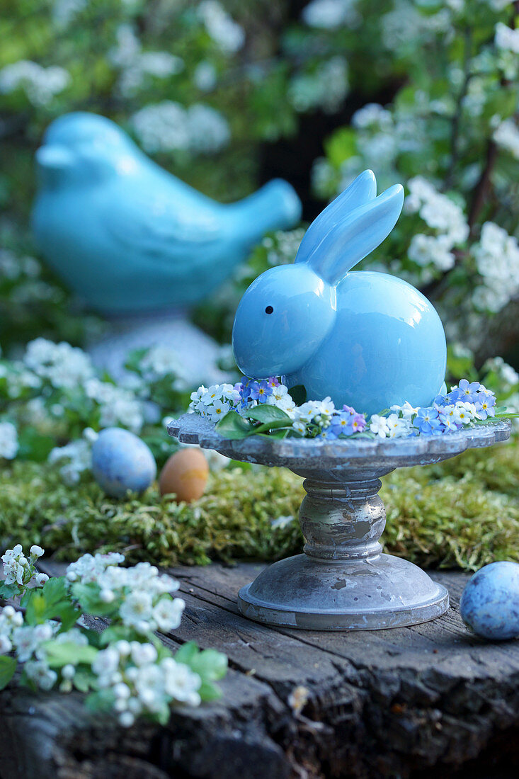 Ceramic Easter bunny in wreath of forget-me-nots