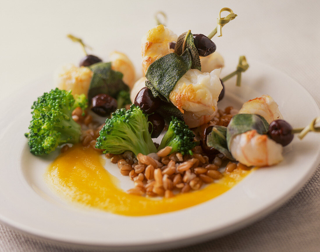 Prawns with sage, broccoli, wheat and olives