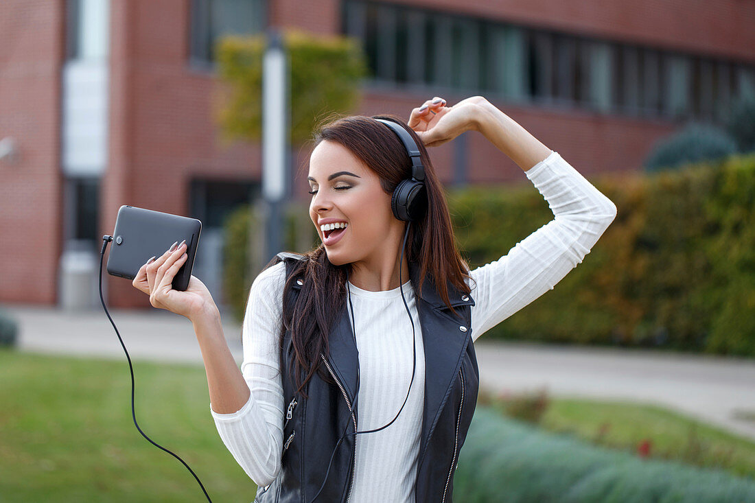 Woman listening to music on headphones