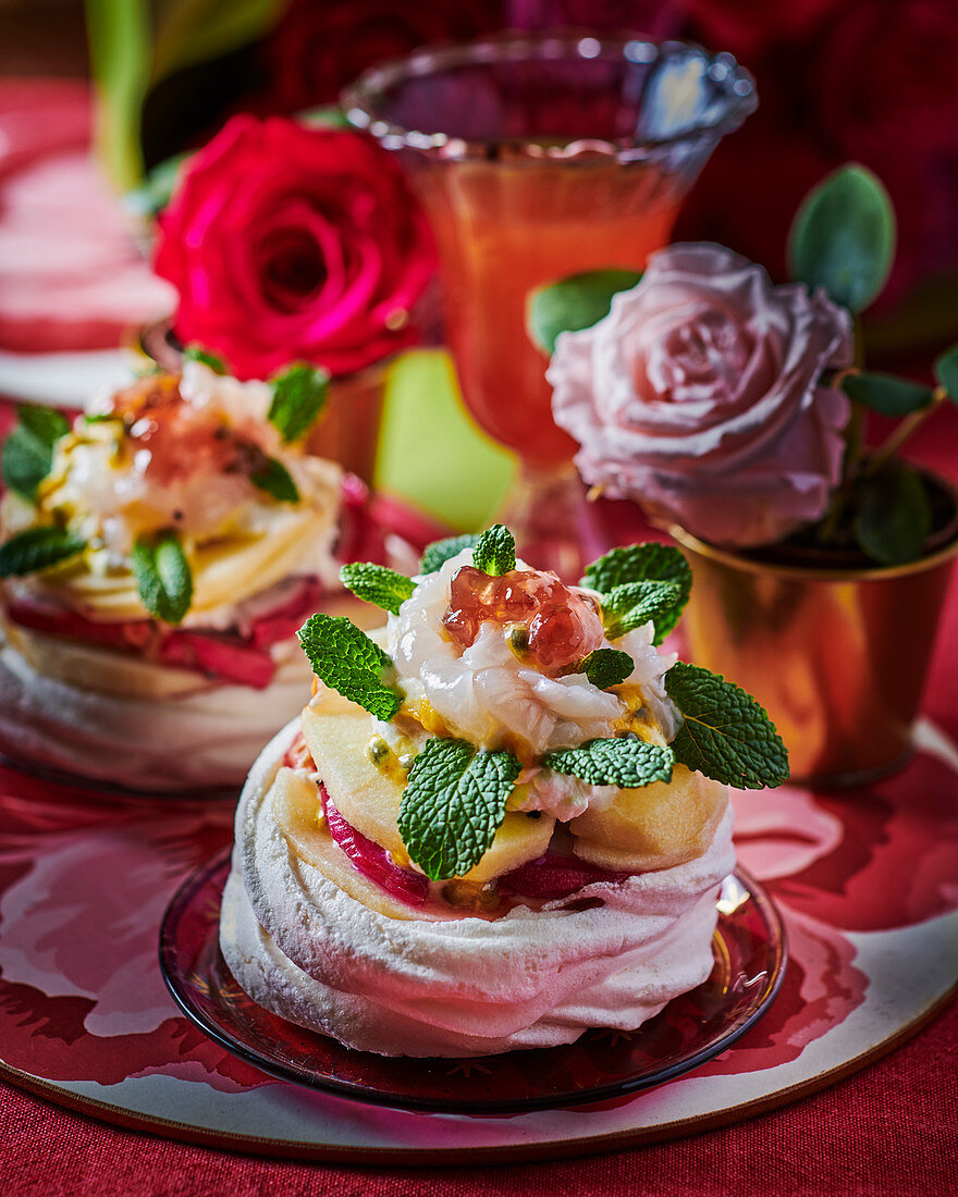 Meringue nests with fruit and mint