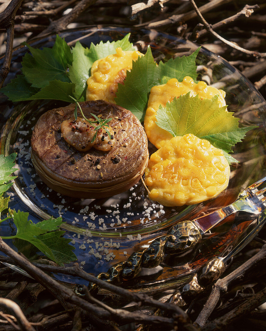 Tournedos with sweetcorn fritters and vine leaves