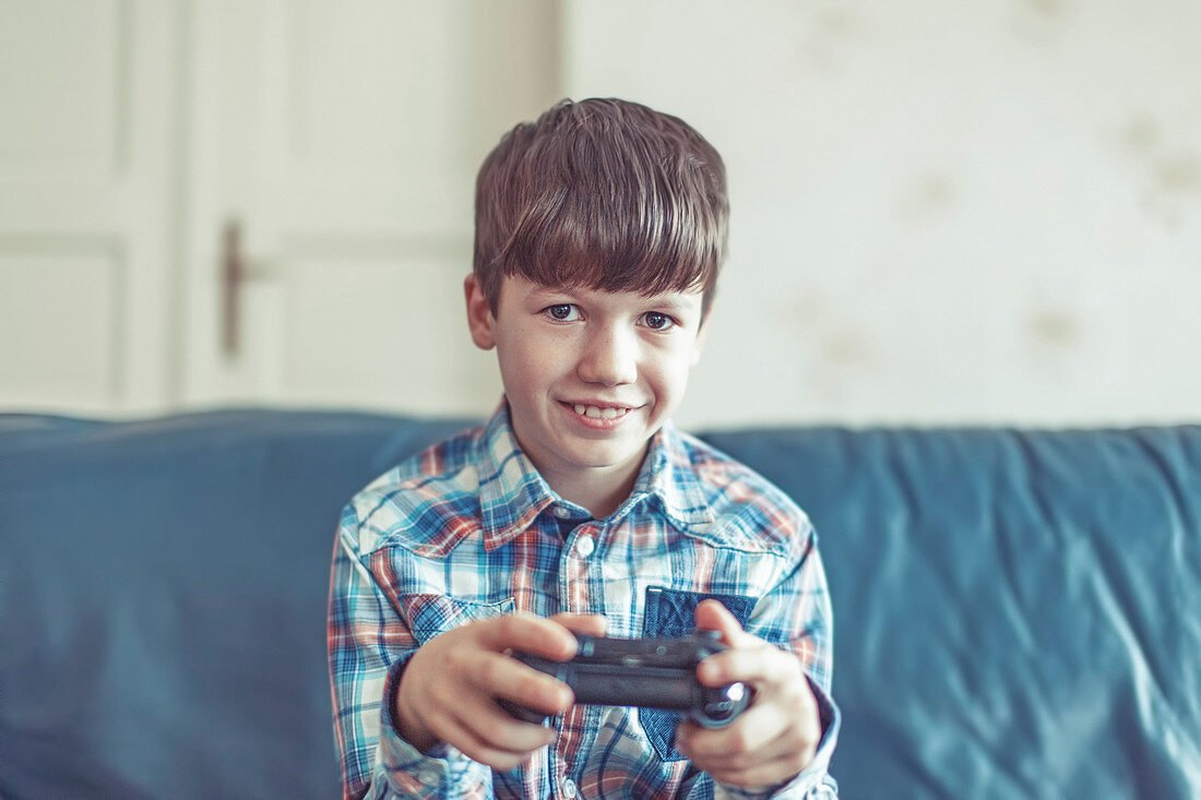 Young boy playing video game