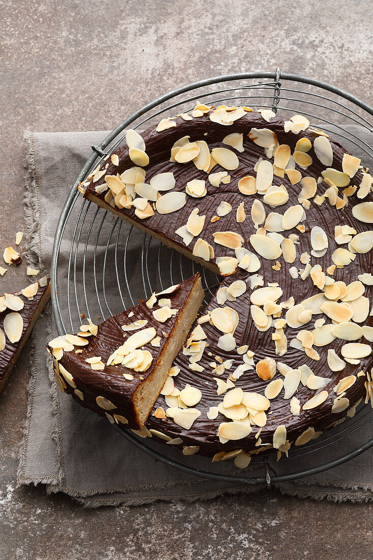 A chestnut cake with chocolate ganache and flaked almonds