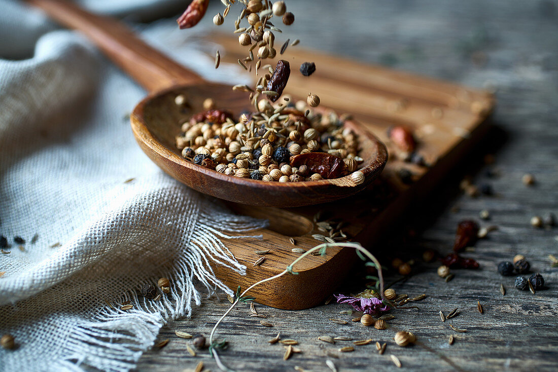 Dried spices on a wooden spoon