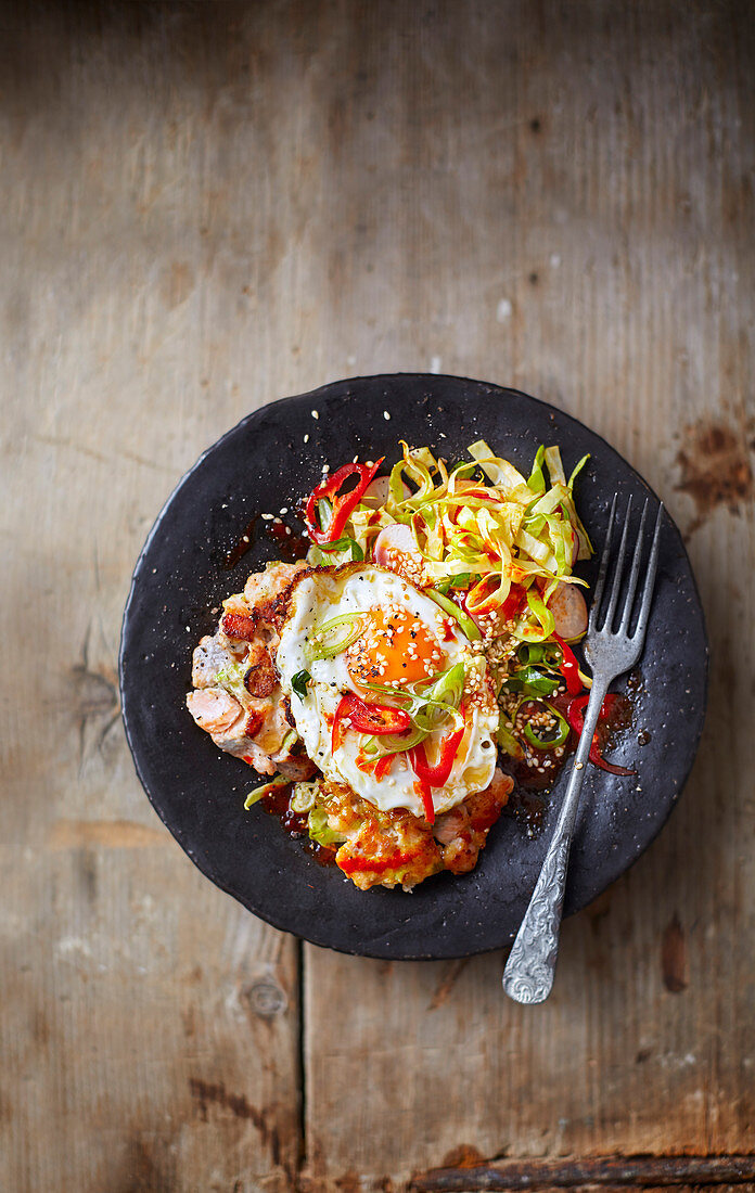 Korean fishcakes with fried eggs & spicy salad