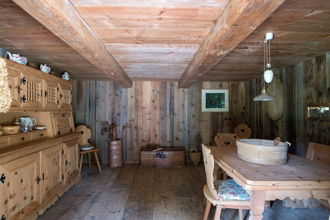 Rustic, wood-panelled farmhouse parlour with low ceiling