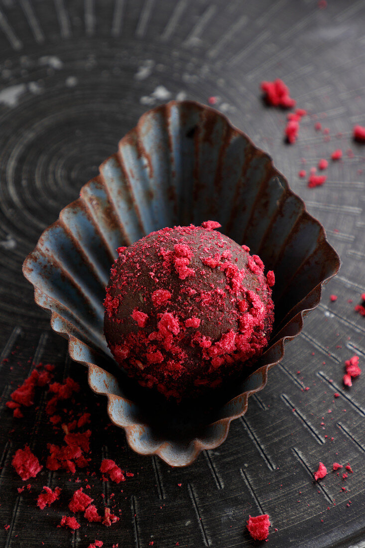 Chocolate truffles with dried raspberry topping