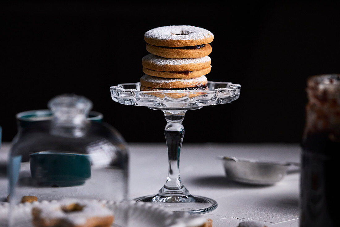 Linzer cookies placed on mini cake stand