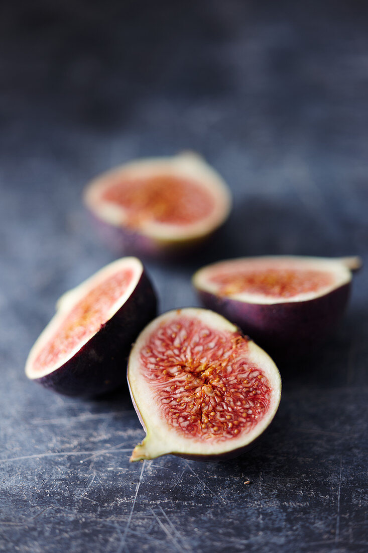 Fig halves on a gray background
