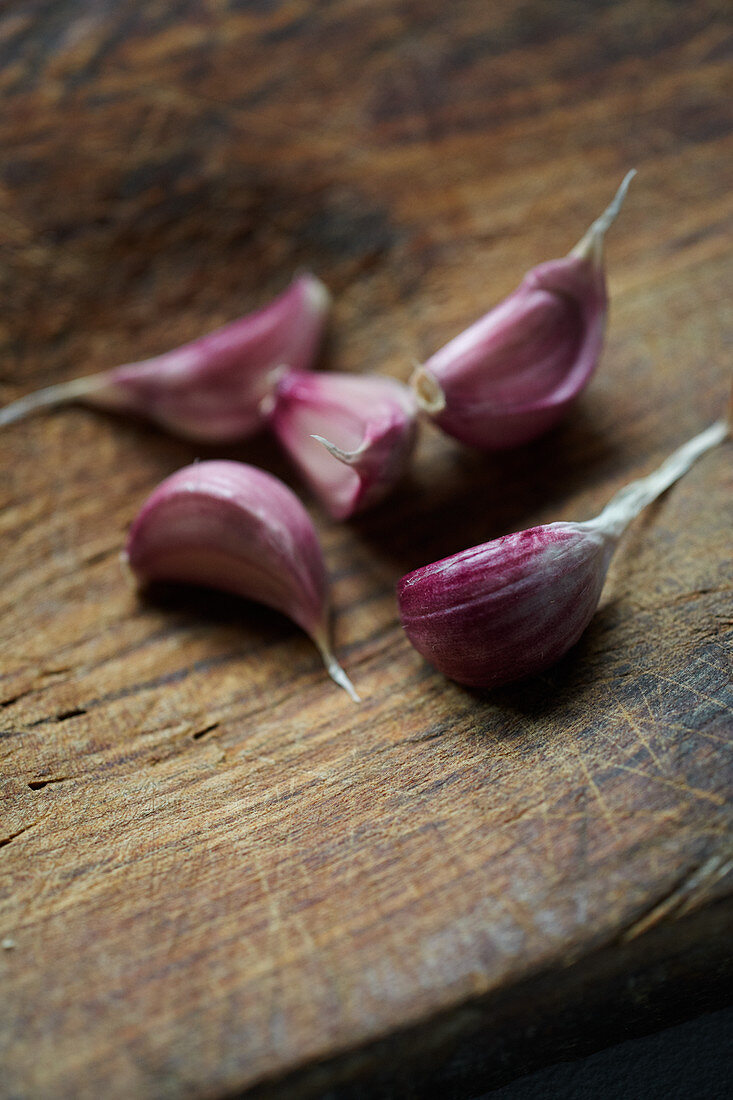 Cloves of garlic on a wooden table