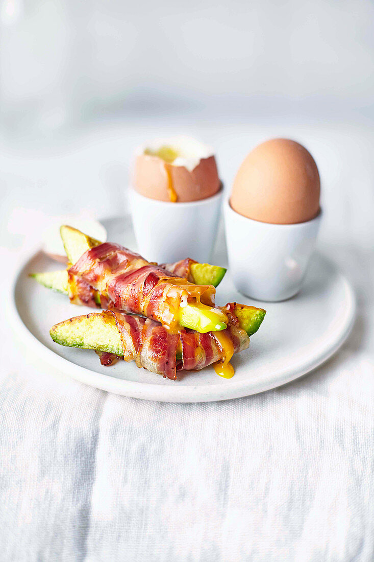 Soft-boiled eggs with pancetta avocado soldiers