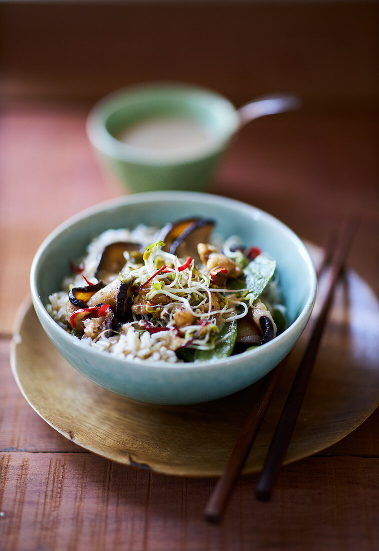Asian vegetable stir fry with mushrooms, sprouts and rice