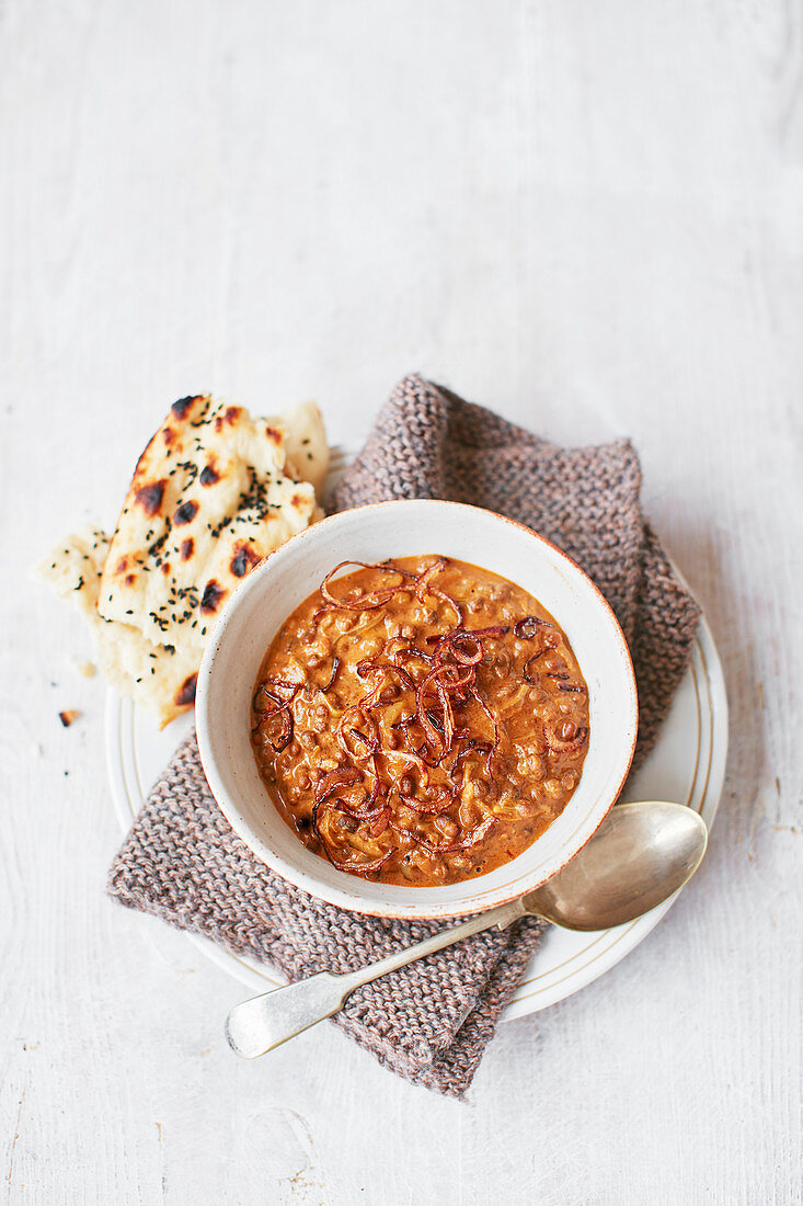 Creamy black dhal with crispy onions