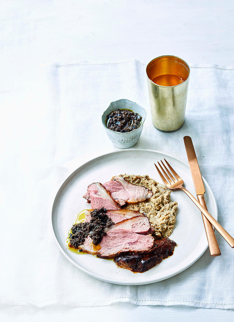 Harissa lamb with smoked aubergine and black olive dressing