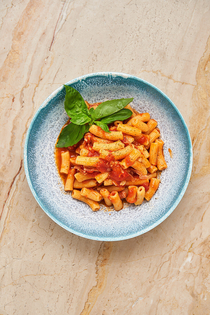 Tasty pasta with herbs and tomato