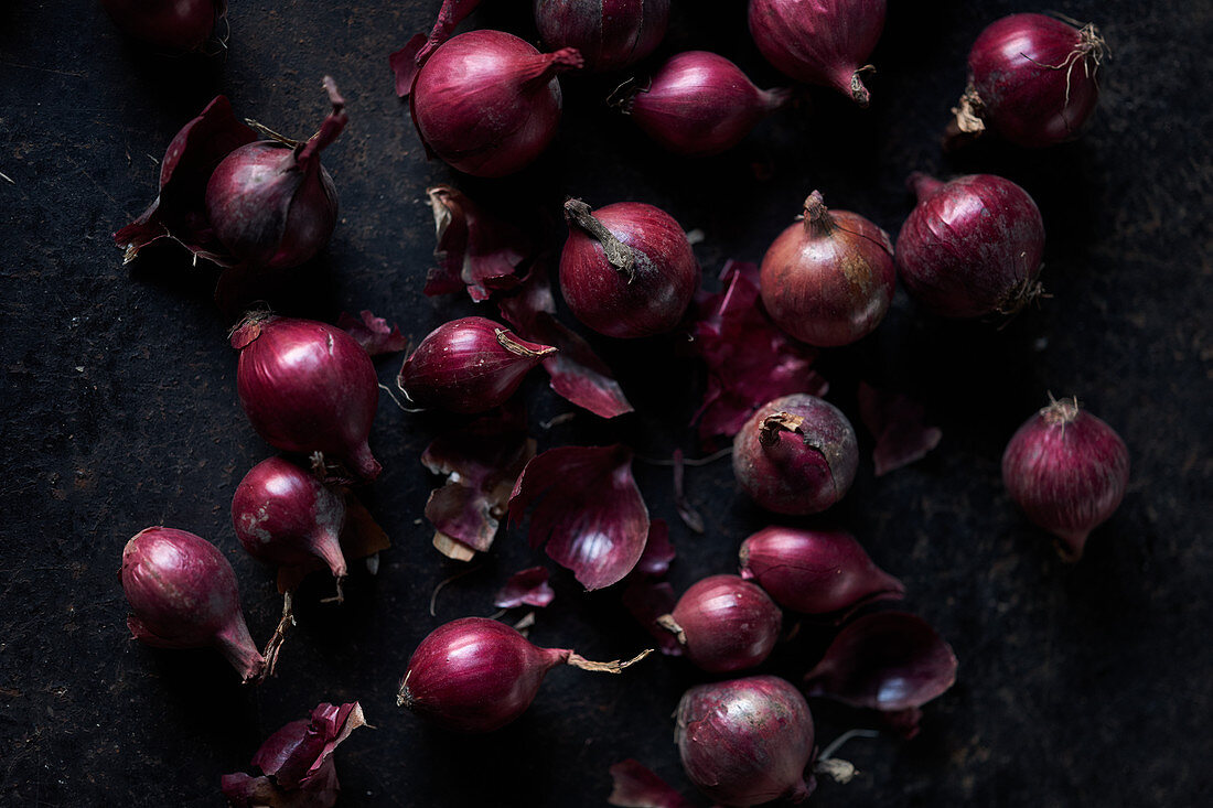 Red onions on a black background
