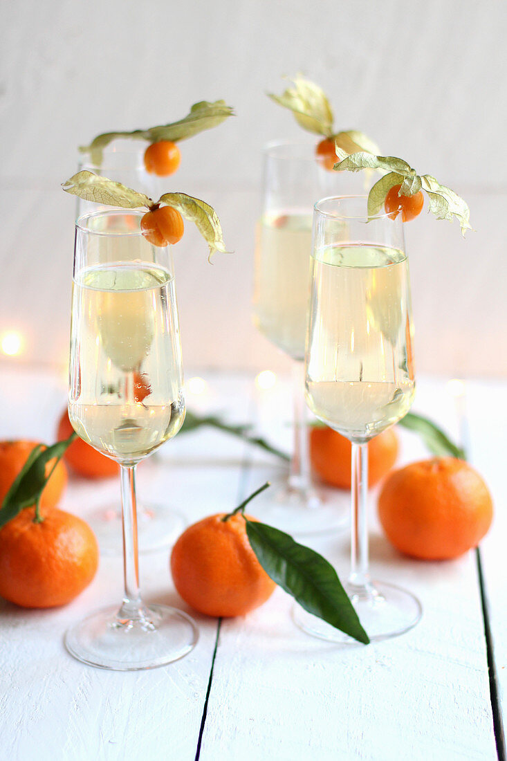Sparkling wine with physalis and tangerines