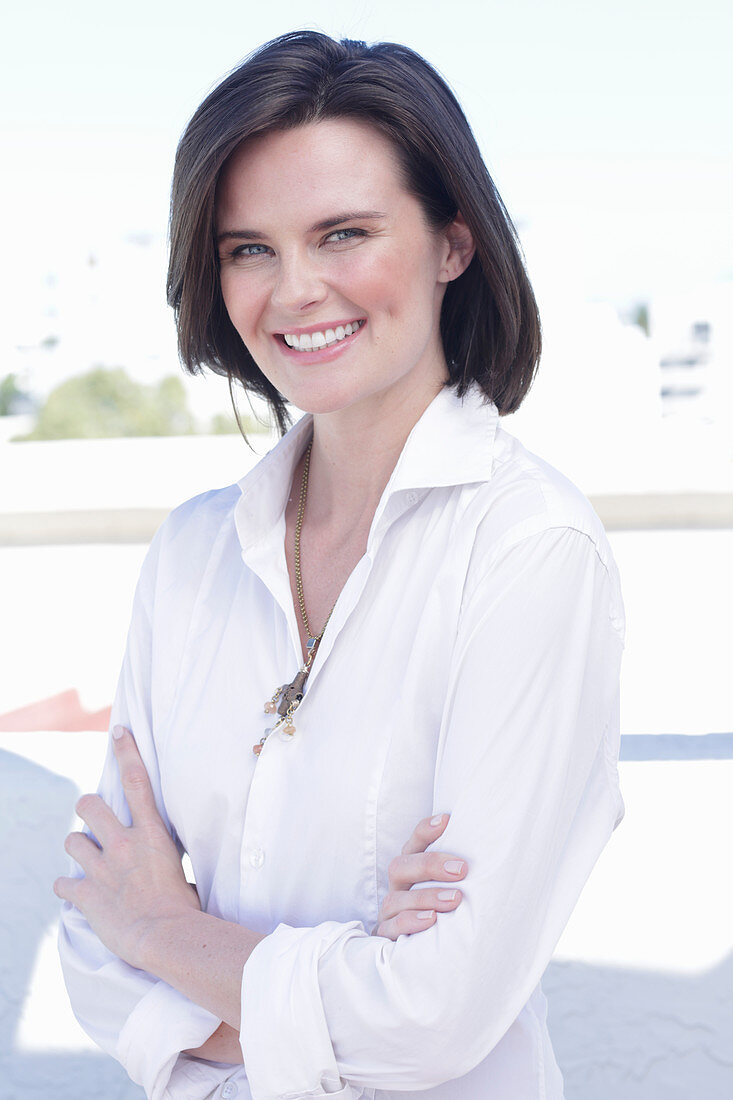 A young woman wearing a white shirt