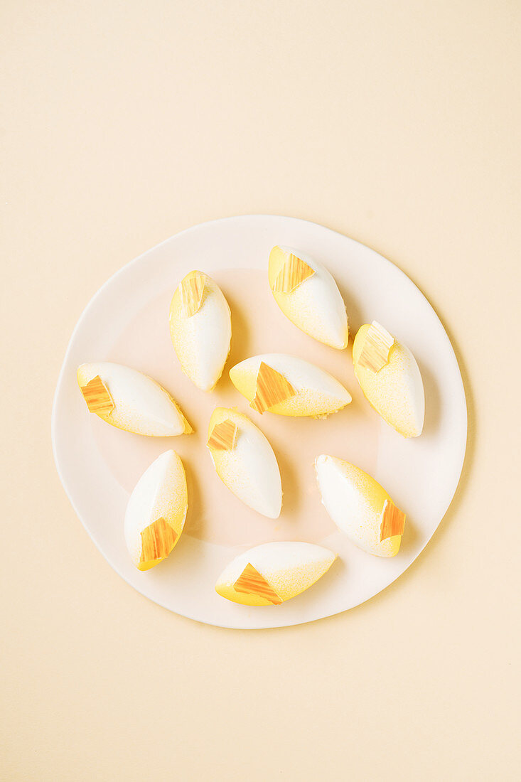 Pieces of delicious fruit dessert placed on yellow background