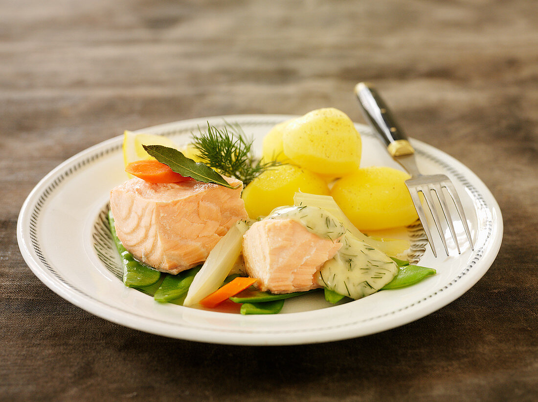 Poached salmon with vegetables