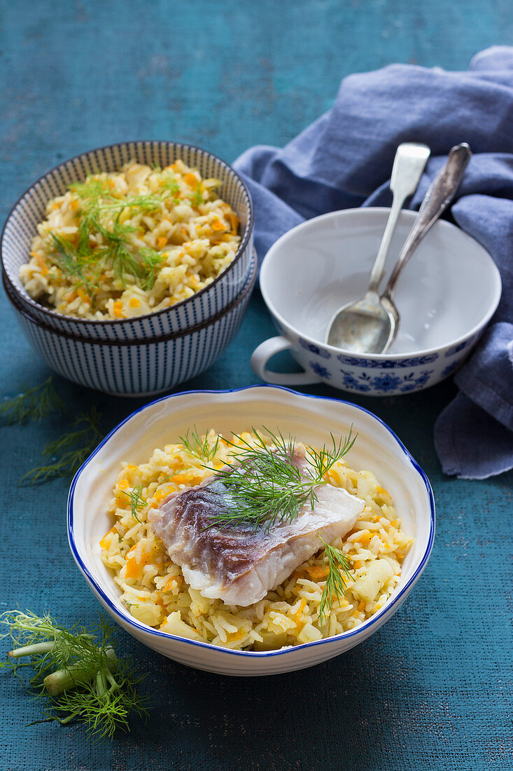 Carrot and fennel pilaf with cod and fennel leaves