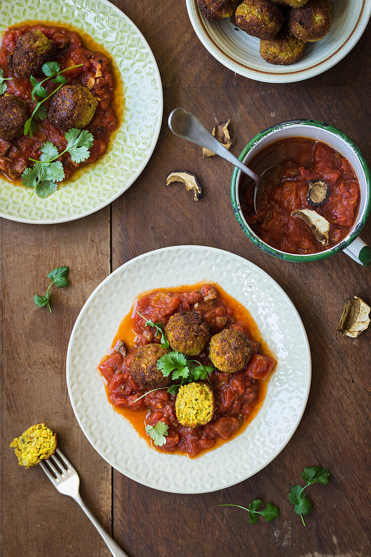 Vegan meetballs from pumpkin and mushrooms in tomato sauce