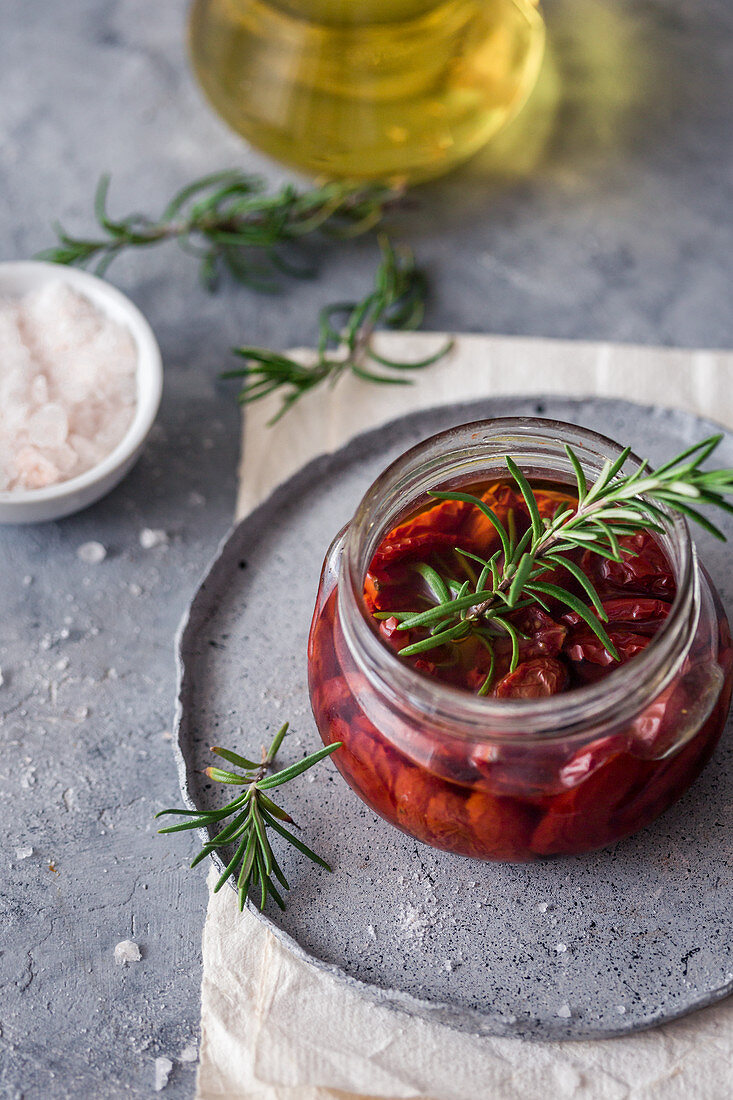 Sun dried tomatoes with garlic and rosemary, in a jar