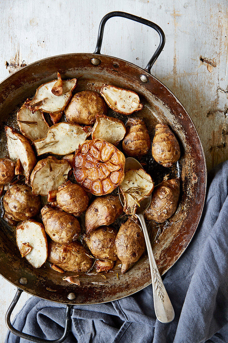 Crispy Jerusalem artichokes with roasted garlic and rosemary